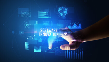 Hand touching SOFTWARE INNOVATION inscription, new business technology concept