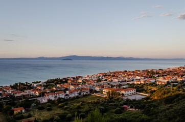 Fototapeta na wymiar Sunset over the coastal, tourist, place Pefkohori, Greece 