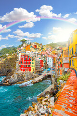 Rainbow on Riomaggiore on the mountain in cinque terre near mediterranean sea in Liguria - Italy...