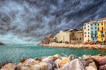 Rain couldy storm on Portovenere (Porto Venere) in Liguria, Italy: scenic view of the Church of St....