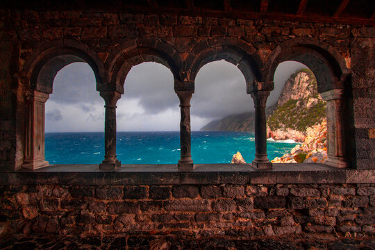 Columns of famous gothic Church of Staint Peter or Chiesa di San Pietro with beautiful scenery in Porto Venere village on the Ligurian coast of northwestern Italy