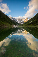 Naklejka na ściany i meble Orobie Alps mirrored in the waters of Lake Zappello, Valtellina, Lombardia, Italy