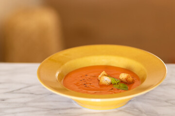 tomato soup with basil, soft background