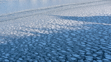 Large chunks of ice blocks forming a beautiful pattern, after the icebreaker ship passed by and crushed the densely packed ice. This is a necessity so that the sea traffic can continue in Stockholm. © Anders