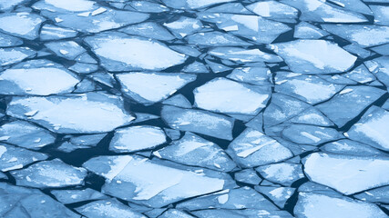 Large chunks of ice blocks forming a beautiful pattern, after the icebreaker ship passed by and...