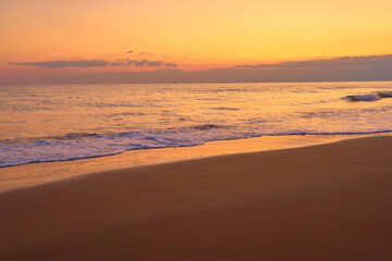 Fototapeta na wymiar Sandy tropical beach at sunset as a backdrop.