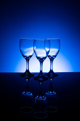 Empty wine glasses with blue background