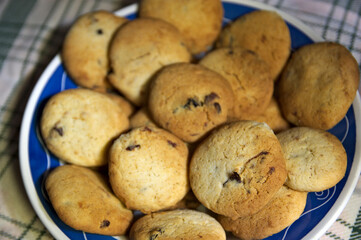 A plate of homemade cookies with sprinkles seen from above