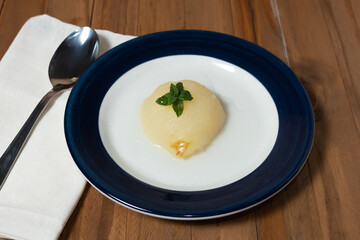 Fresh half Pears Served with sweet syrup. Wooden table background.