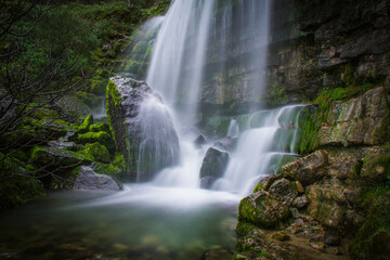 Beautiful waterfall in the mountains of Serra de Aire, Portugal. Long exposure of the waterfall of Fornea in Porto de Mos, Portugal. 