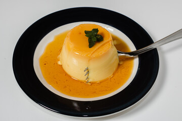 Delicious typical dessert from South America called Flan, made with eggs, milk, vanilla and flavored with caramel.