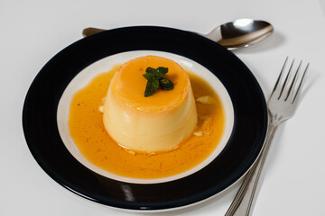 Delicious typical dessert from South America called Flan, made with eggs, milk, vanilla and flavored with caramel.