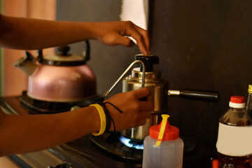 Barista cafe Prepare espresso and vietnam coffee drinks at the coffee shop. portrait of a coffee shop employee making coffee at the bar. the process of making warm drinks with a vintage color concept