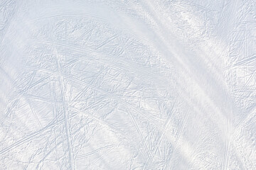 Snow-covered ice with ski tracks top aerial view