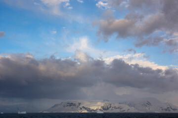 Fototapeta na wymiar Antarctica. Gerlache Strait. Mixed clouds.