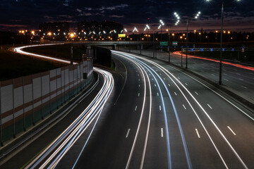 Fototapeta na wymiar Scenic light trails of fast traffic on a highway
