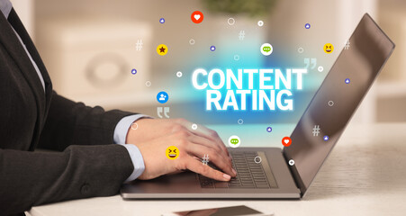 Freelance woman using laptop with CONTENT RATING inscription, Social media concept
