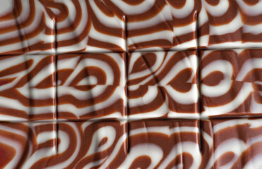 Chocolate bar close up. White and milk chocolate. Chocolate texture.