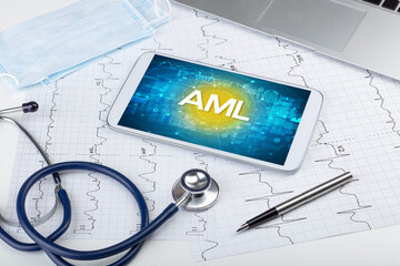 Close-up view of a tablet pc with AML abbreviation, medical concept