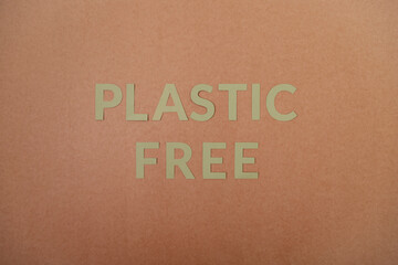 Plastic Free cardboard letters on a craft paper
