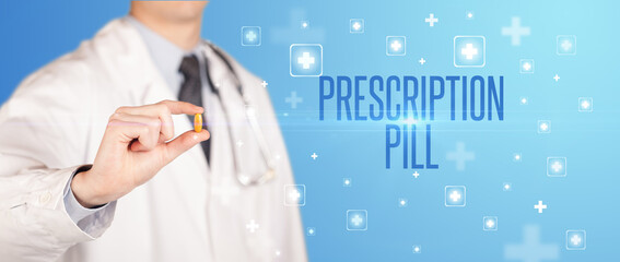 Close-up of a doctor giving a pill with PRESCRIPTION PILL inscription, medical concept