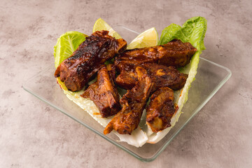 Grilled pork ribs with BBQ sauce with fresh lettuce