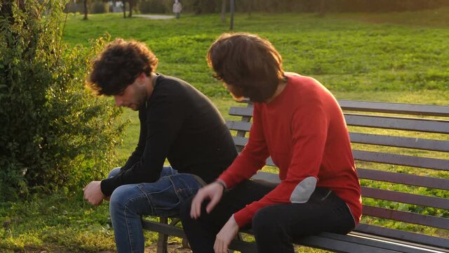 affection, comfort - young man consoles his sad friend who has lost the job