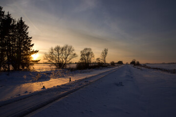 Winter landscape at sunset time.