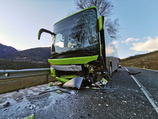 Violent frontal collision between a bus and a car traveling in the opposite direction. The...
