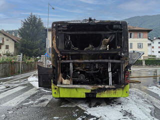 Burnt public traffic bus is seen on the street after caught in fire during travel and extinguished...