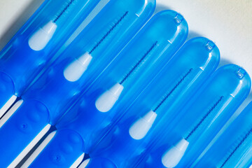 Blue with white interdental brushes. Oral hygiene. Brush your teeth thoroughly. Interdental-Sticks	