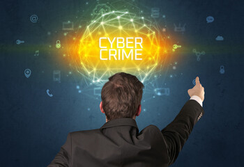 Rear view of a businessman with CYBER CRIME inscription, online security concept