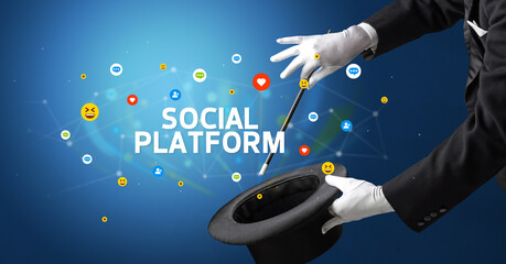 Magician is showing magic trick with SOCIAL PLATFORM inscription, social media marketing concept