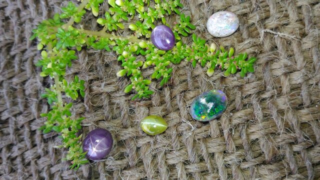 Closeup View Of Precious Gemstones Kept On A Jute Cloth