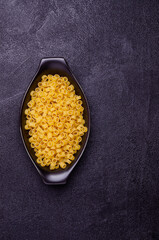 Dry pasta in a ceramic dish