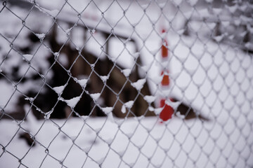 Fence covered in snow