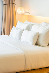 White pillow on bed decoration interior of bedroom