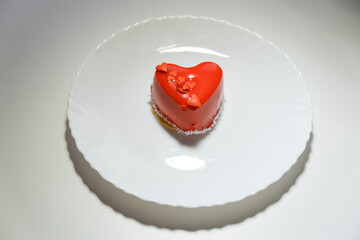 heart-shaped cake on February 14. food, cheesecake for Valentine's day on a white background.