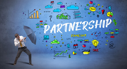 Determined businessman hiding behind umbrella with PARTNERSHIP inscription, new business concept