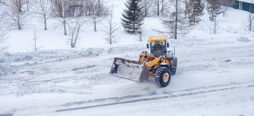 Cleaning and cleaning of roads in the city from snow in winter