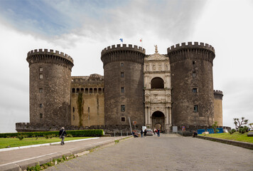 Tourists visiting and resting after inspection Castel Nuovo (Anjou dungeon)