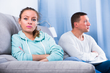 Husband and wife having disagreement with each other at home