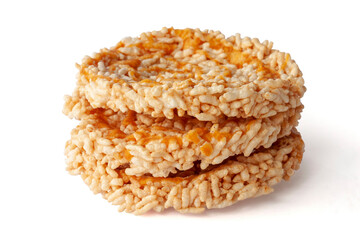 Stack of Thai sweet crispy rice cakes with cane sugar drizzle Thai people call Khaotan isolated on white background.