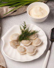 Hand-made dumplings. Cooking dumplings. Cooked dumplings with herbs and vegetables