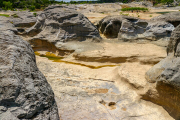 Beautiful geological limestone riverbed on the Pedernales river with natural formations on a Spring day in Pedernales Falls State Park, Burnet Texas Hill Country.
