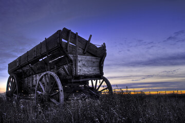 Old wooden wagon in a field near Drumheller, Alberta, Canada