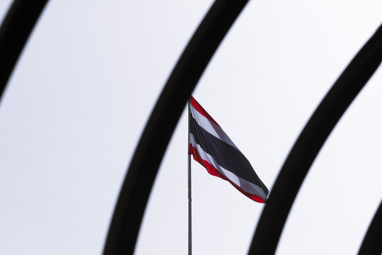 Thai Flag Through The Fence On White Sky Background