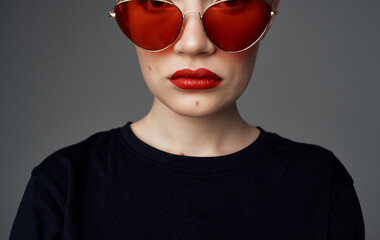 Pretty woman dark glasses makeup red lips short hair close-up