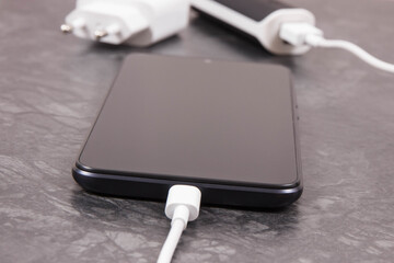 External powerbank charging empty battery of smartphone or mobile phone