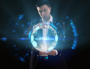 Business, Technology, Internet and network concept. Young businessman working on a virtual screen of the future and sees the inscription: Business transformation